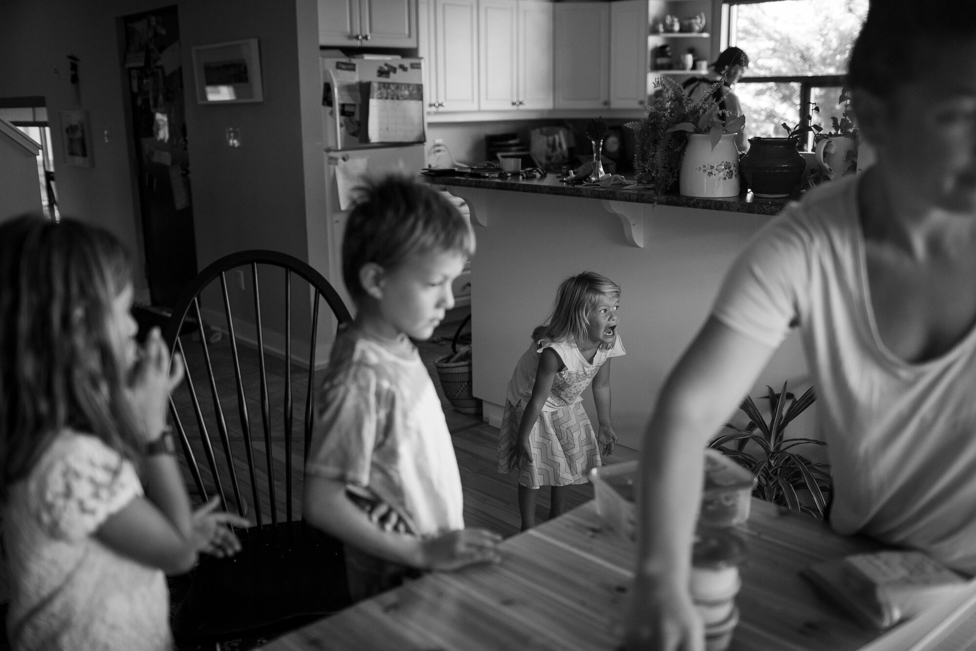 funny photo of little girl yelling to get family's attention