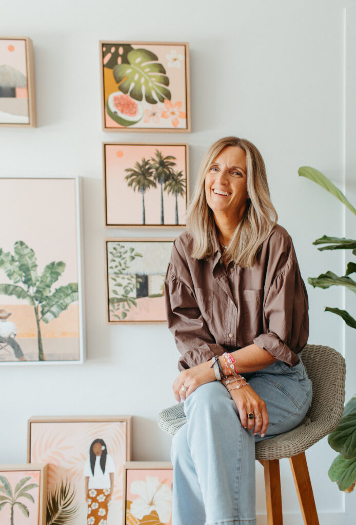 Surf Coast artist Penny Byrne with her original paintings for Greenhouse Interiors as photographed by brand photographer Bobby Dazzler
