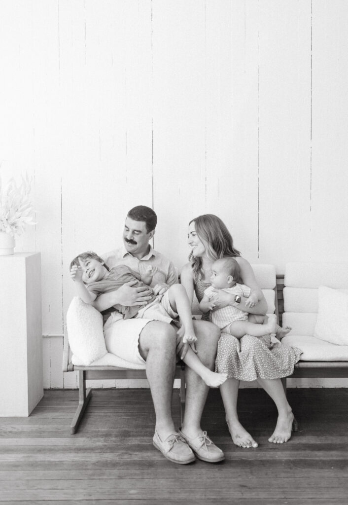 Black and white image of lifestyle family session at the Rook and Rose Loft