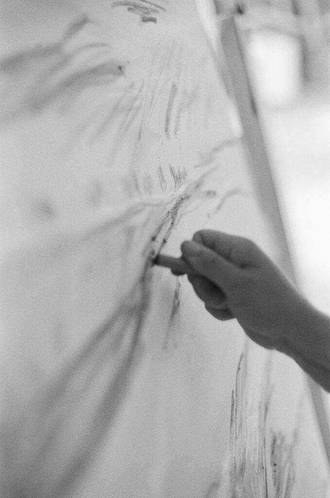black and white close up of Erin Reinboth drawing